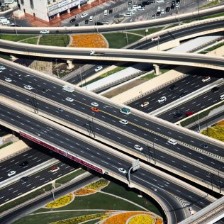 Cars driving fast on Dubai roads