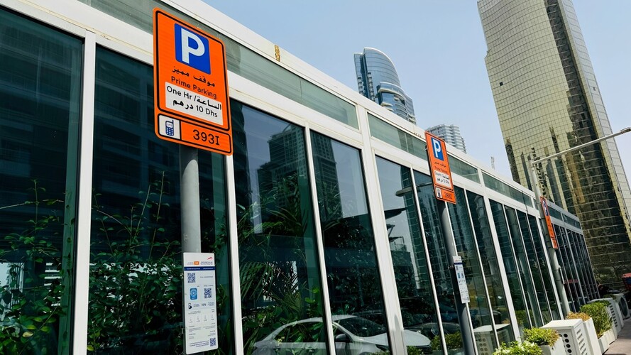 Parking signs with zone code to help parked drivers know how to enter the correct information to pay for the parking fee